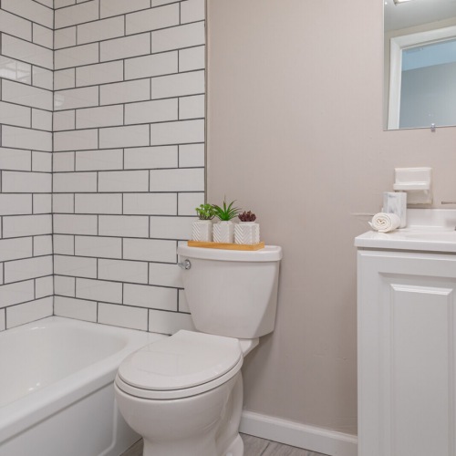 Large, well-lit bathroom with modern conveniences